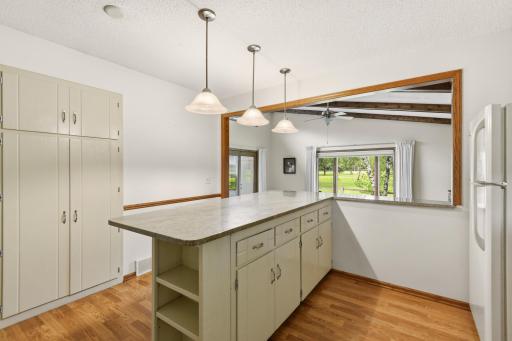 Nice view from kitchen into family room overlooking golf course