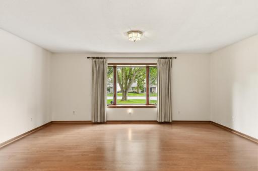 The deep front yard offers a beautiful view from the front living room
