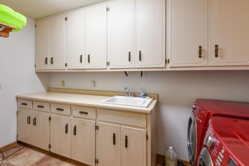 Big laundry room with tons of cabinets ~ complete with drop in sink