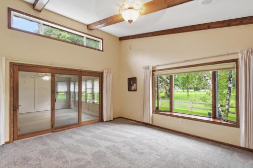 Access from family room and owner's suite to large 3 season porch