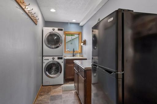 main floor laundry room with built in cabinets
