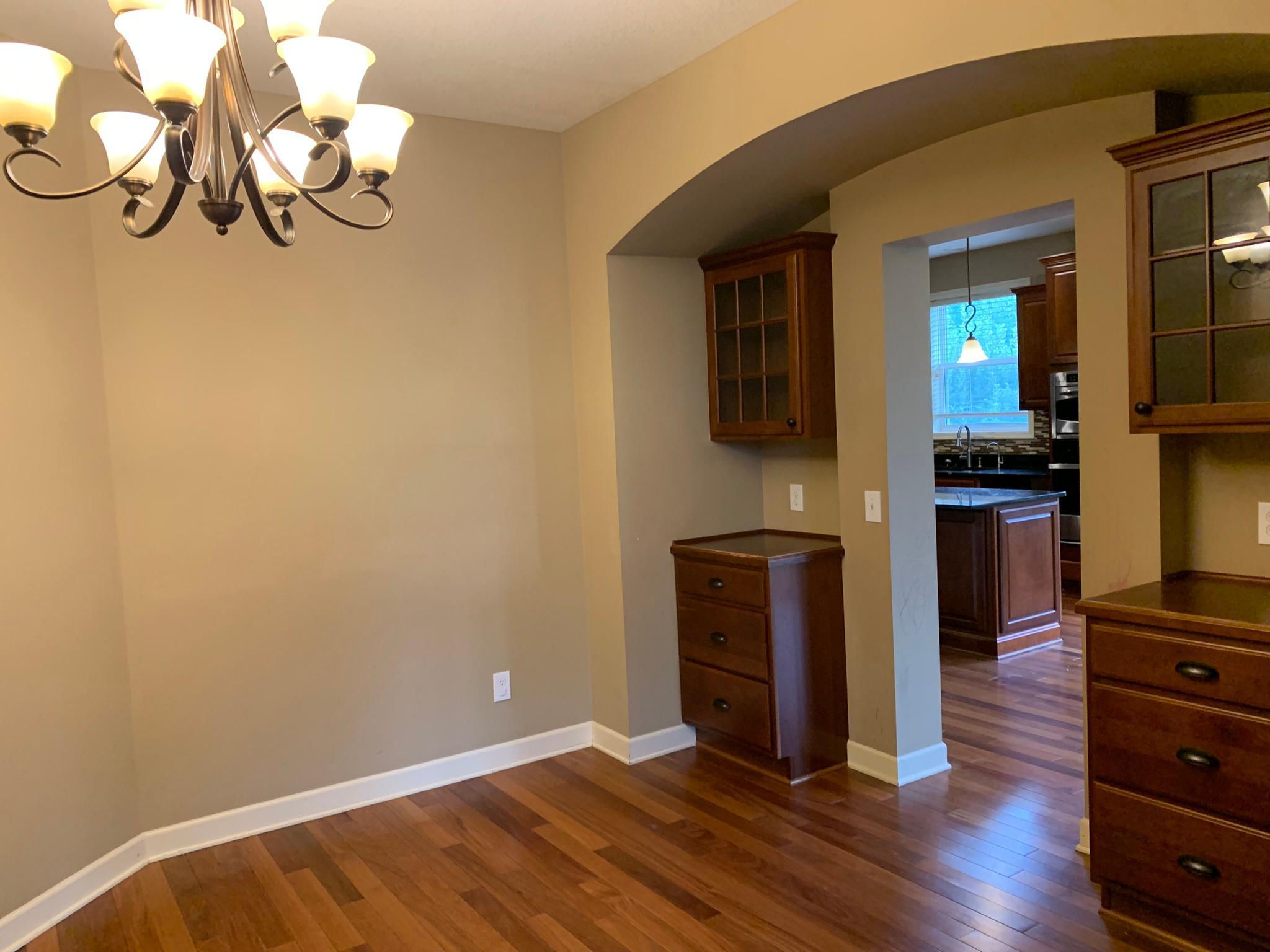 6 - Formal dining room with built in cabinets.JPEG