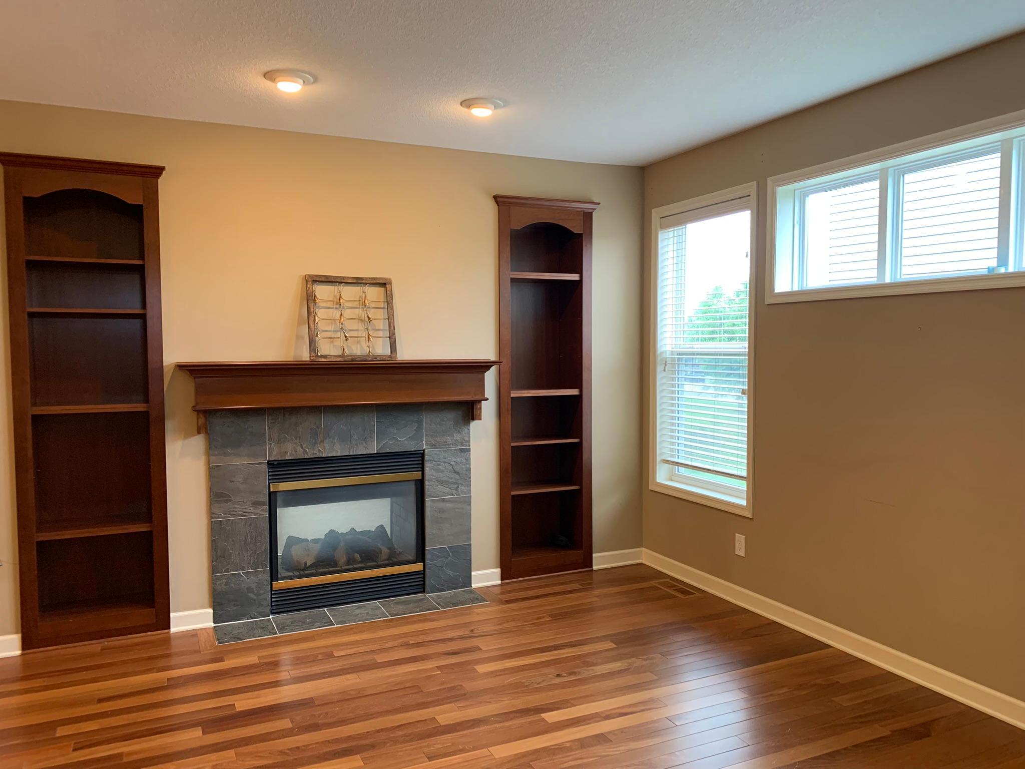 4 - Living room - gas burning fireplace.JPEG
