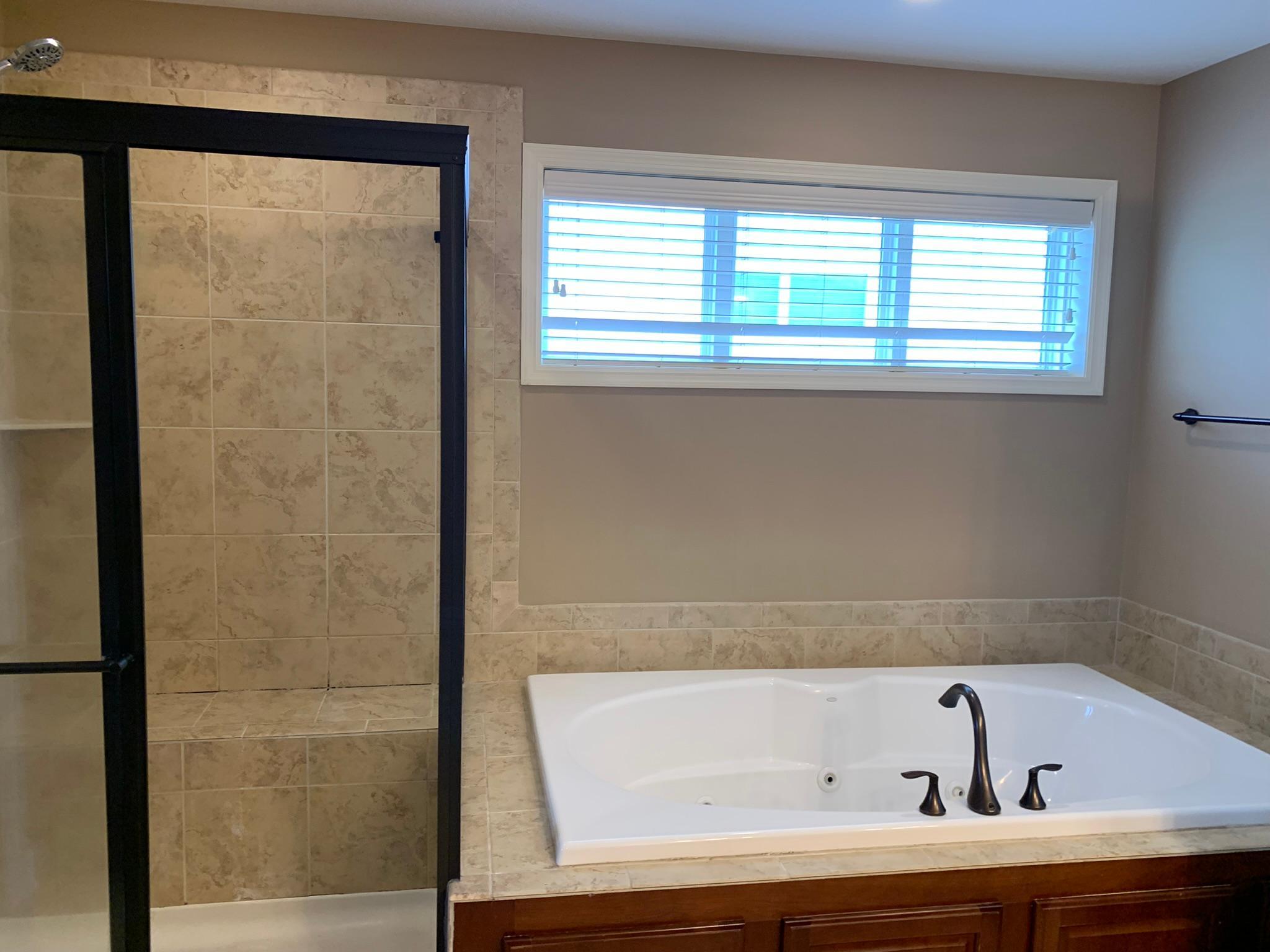 22 - Primary bath - separate tub and shower.JPEG