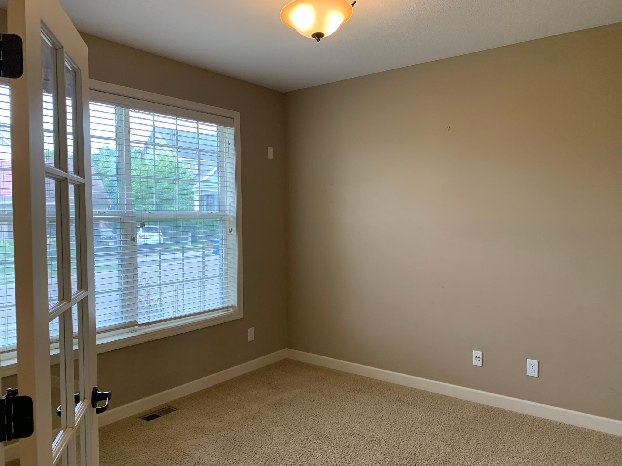 5 - Main floor office with glass insert french doors.JPEG
