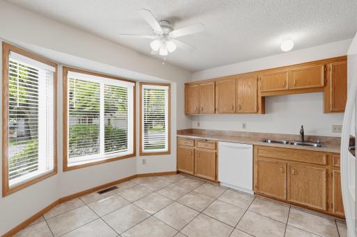 Sunlit bay window brightens the mood as your prepare your meals