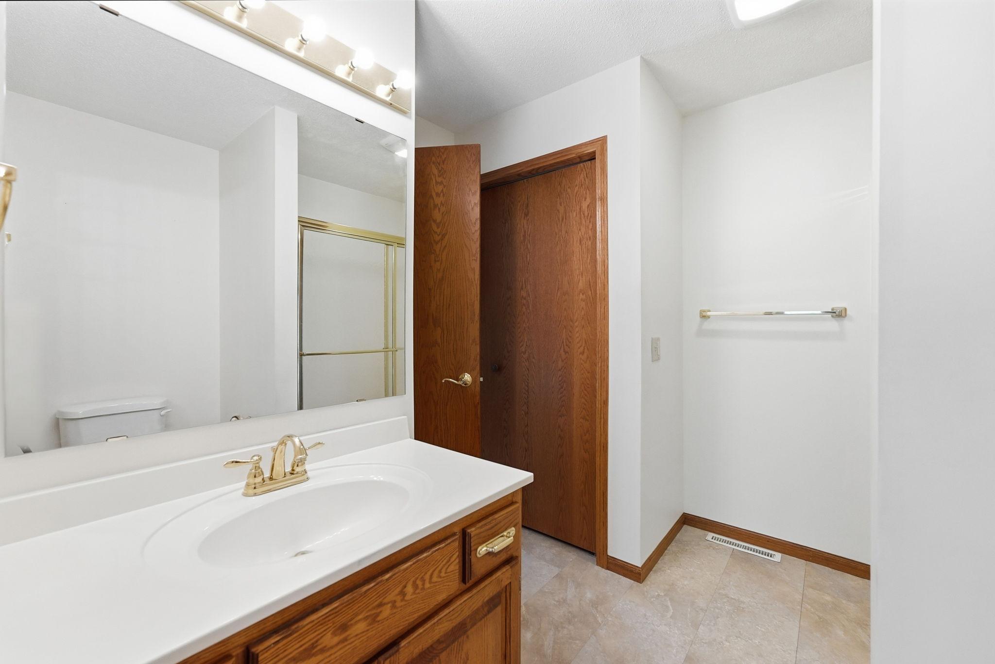 Private primary bathroom with dual vanities create for an easy morning routine.