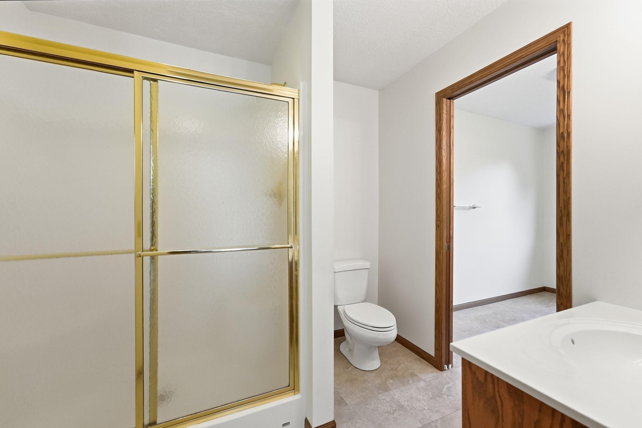 3/4 bathroom with a dual vanity.