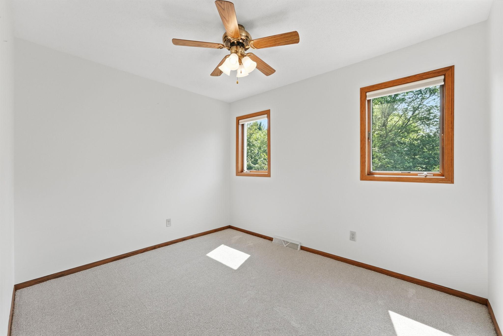 Another upper level bedroom with plush 2026 new carpeting.