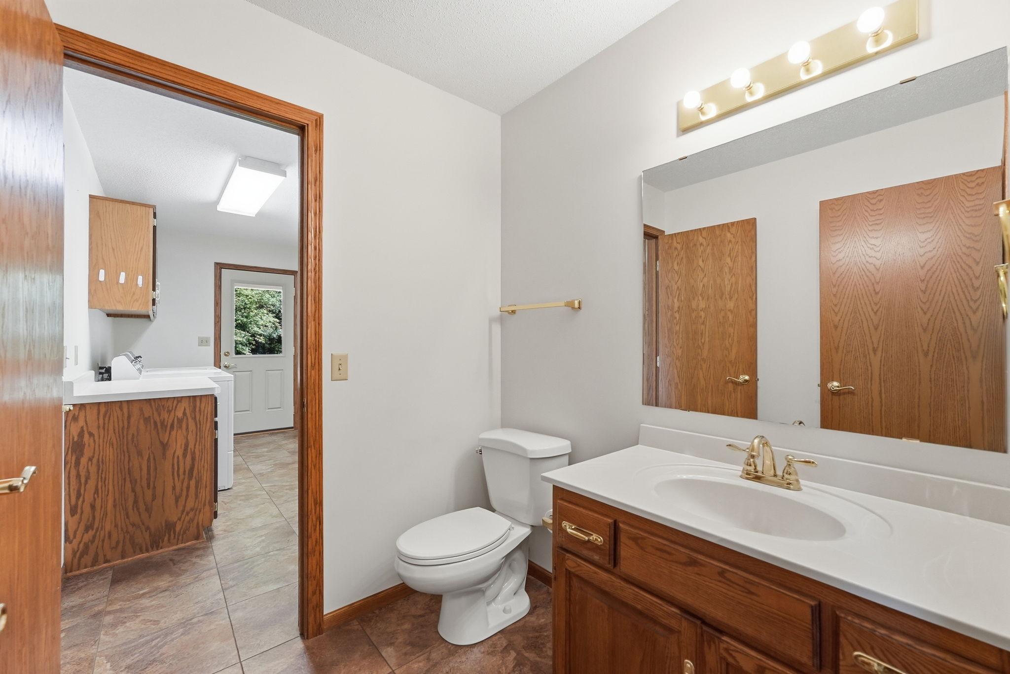 Off of the laundry and mud room is another main level bathroom.