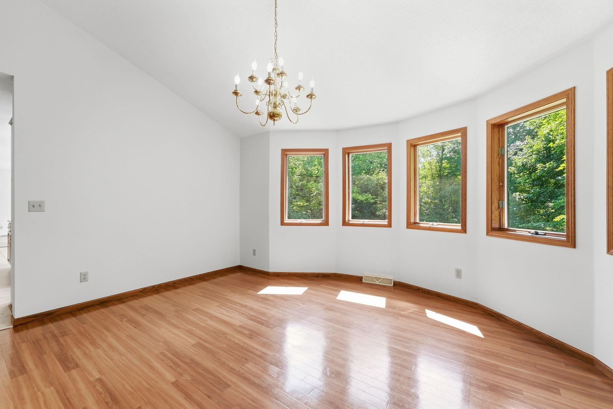 A sophisticated formal dining area adds timeless charm and functionality to the home.