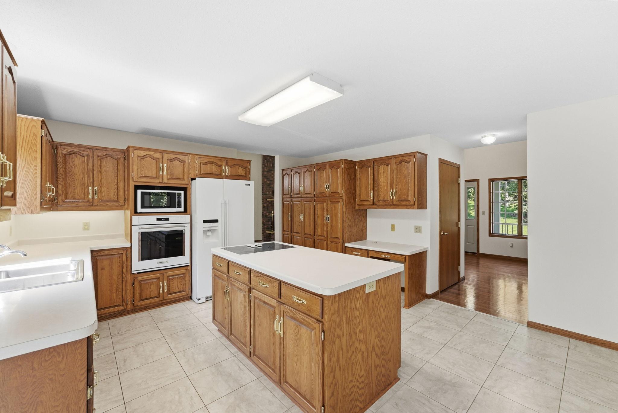 Oversized island offers exceptional workspace, storage, and everyday functionality.