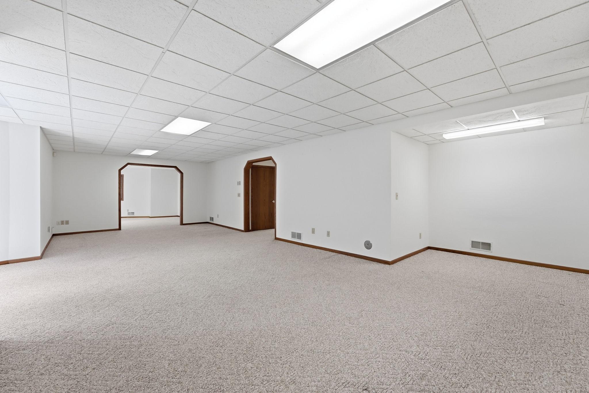 A versatile lower-level lounge offers room for entertainment, hobbies, or quiet evenings.