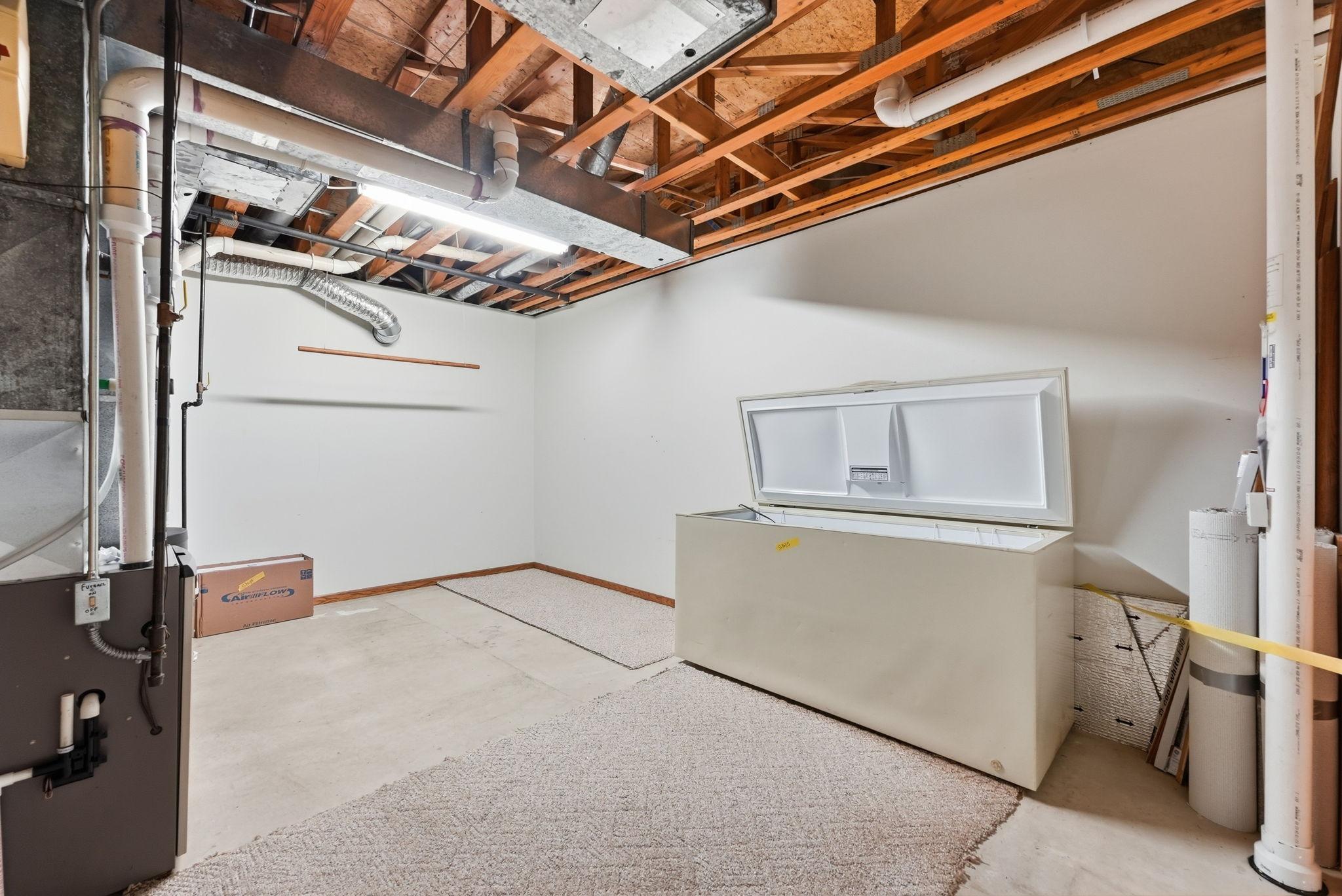 Mechanical room featuring 2011 AC, 2015 furnace, and 2017 water heater and softener, with annual maintenance checks performed.