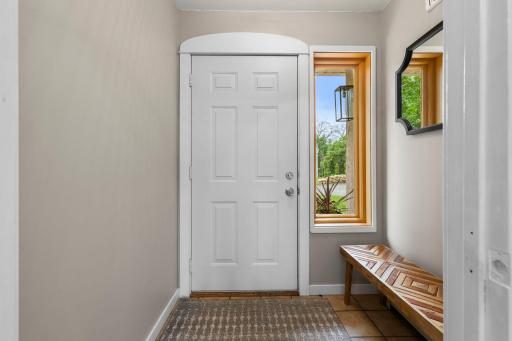 The entry foyer is crisp and clean introducing guests to soaring views.