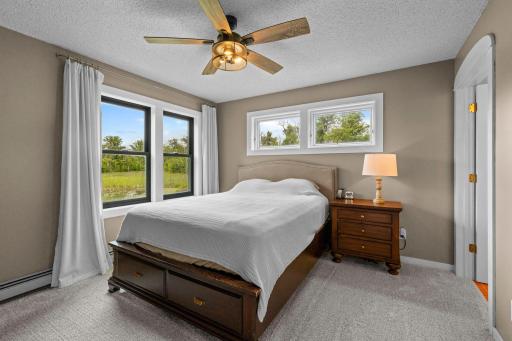 The owners suite has a ceiling fan, new carpet and incredible views.
