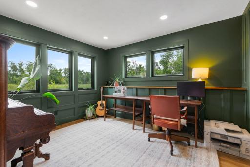 The lower level has the second bedroom is rich and warm with windows on two sides.