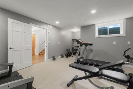 The lower level family room is currently used as a gym.