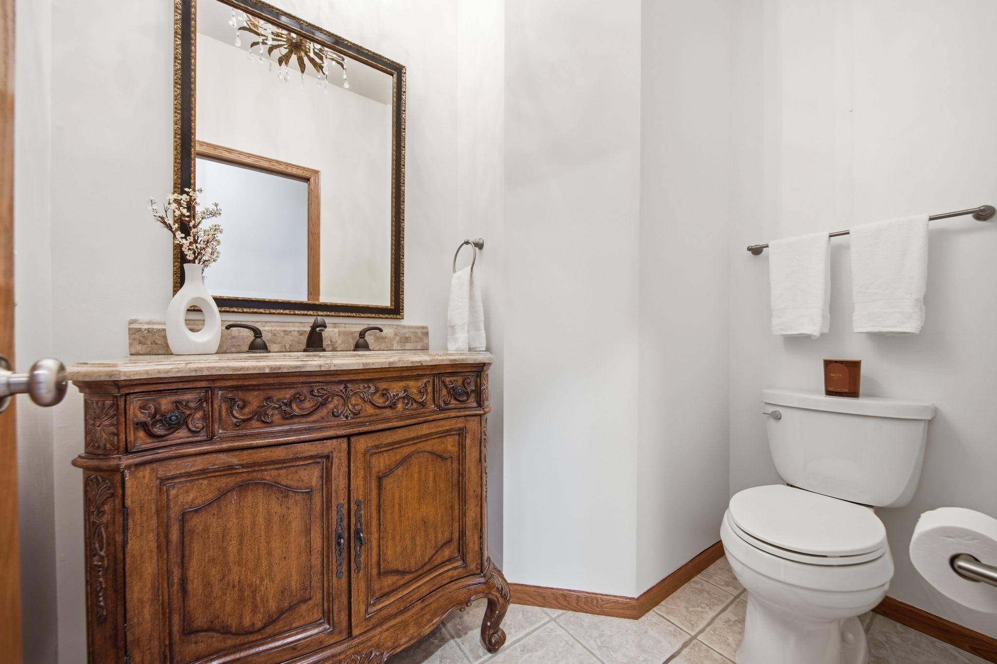 This powder room, conveniently located right off the kitchen, has been freshly painted in Swiss Coffee.