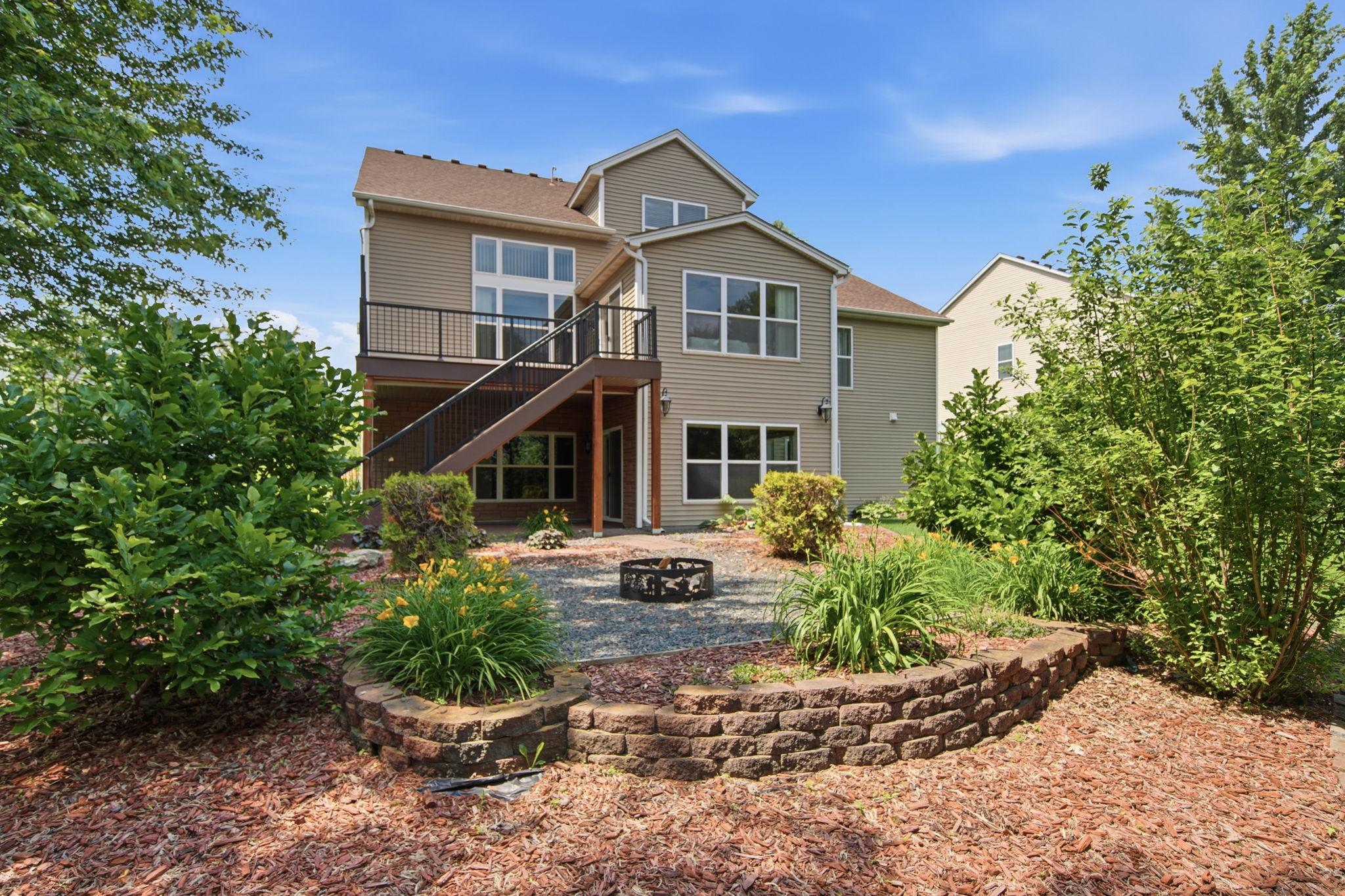 A picturesque view of the beautiful backyard, set on nearly a half-acre lot—an ideal setting for relaxing, entertaining, and connecting with wonderful neighbors.