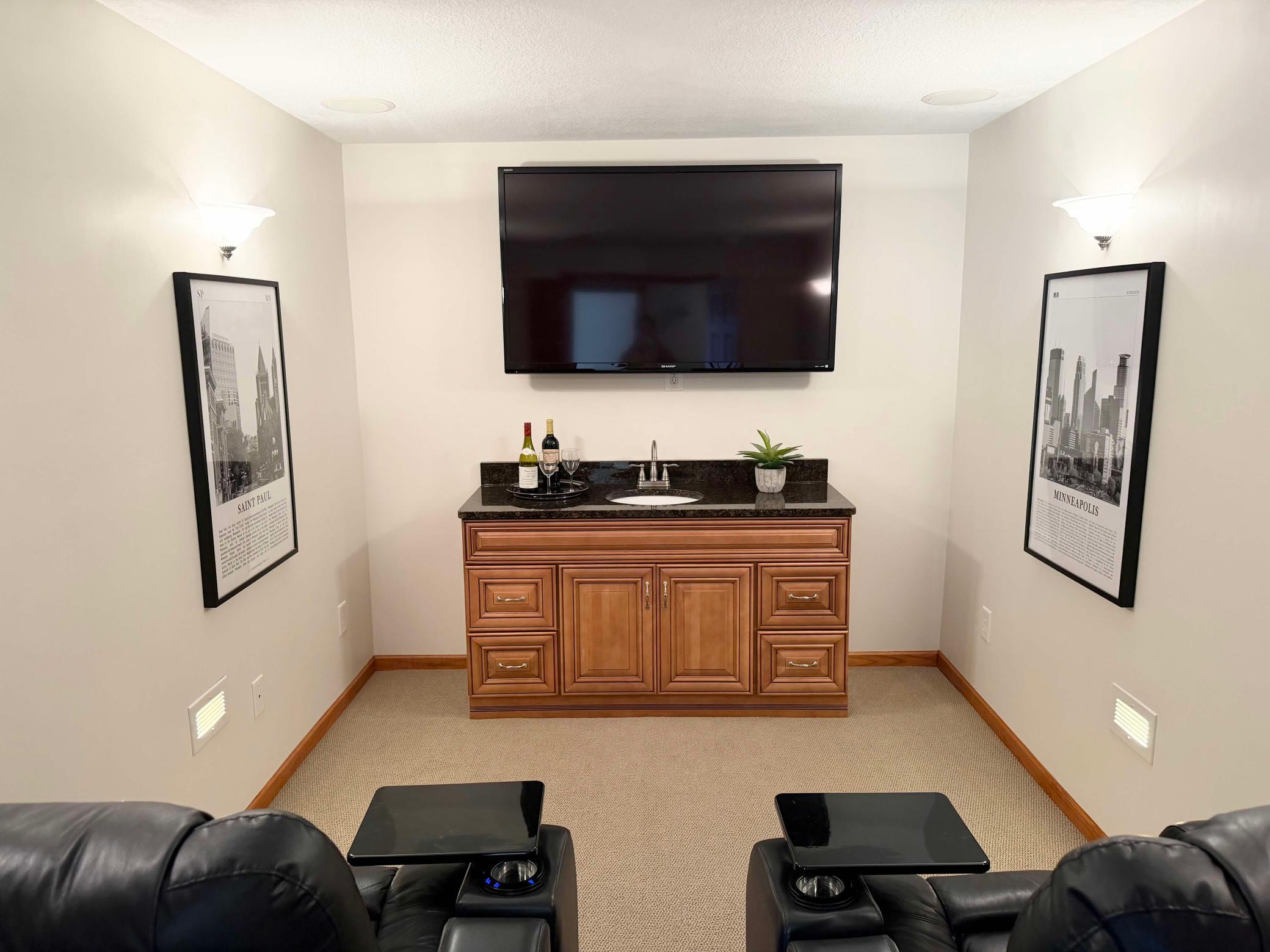 One of the home’s standout features is your very own theatre room, complete with a stylish bar area—perfect for cozy evenings spent enjoying your favorite movies.