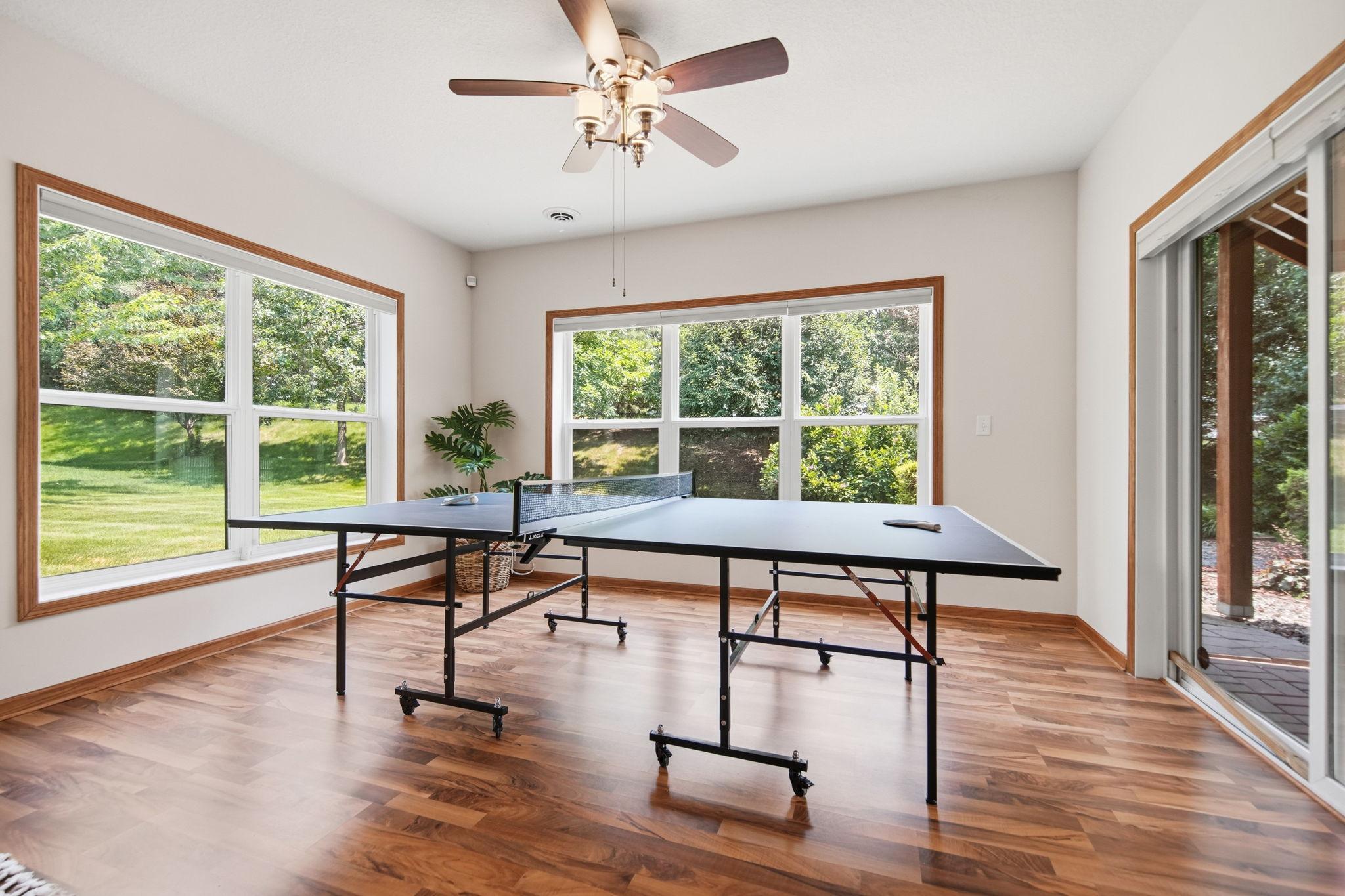 Ping pong table - would also fit a pool table:) Great area with lots of natural light streaming in!