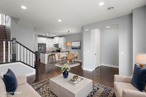 Open concept, Living room expands into the Kitchen and Dining area. Virtually staged.