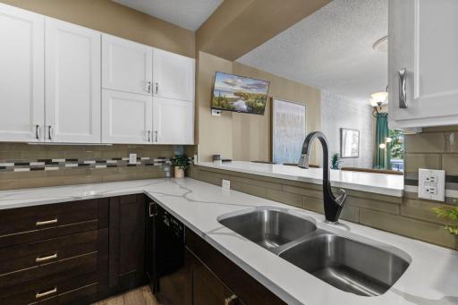 You'll enjoy the beauty of the quartz countertops with a deep under-mount sink and contemporary faucet