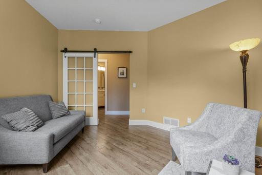 A sliding door allows for optimal use of the floor space in this room