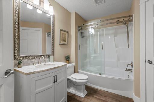 The main floor bath has been tastefully updated with quality fixtures and finishes