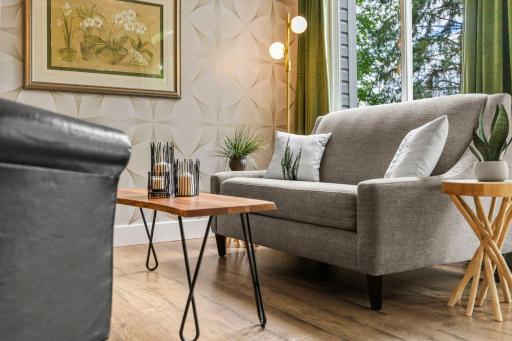 The entire main level living areas feature waterproof luxury vinyl plank flooring