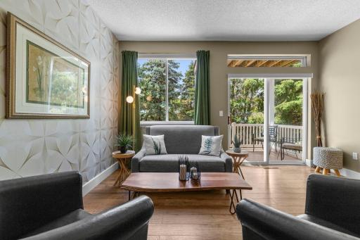 A sliding door provides access to the deck and brings tons of light into the space