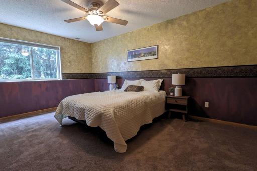 The lower level bedroom has a big daylight window bringing the outdoors in