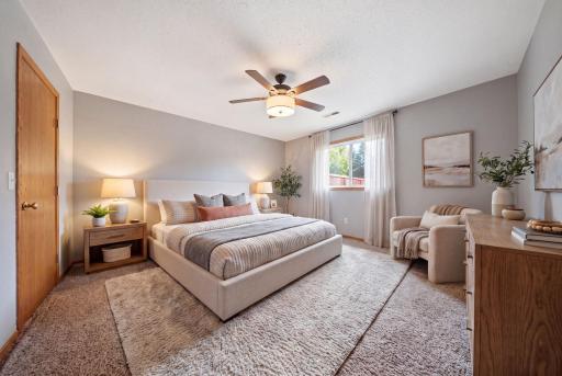 Two generously sized bedrooms provide comfortable retreats, including a primary suite with a walk-in closet and direct access to the main bath. (virtually staged)