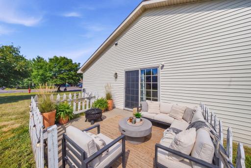 Step outside to a private patio with a privacy fence and spacious corner lot. (virtually staged)