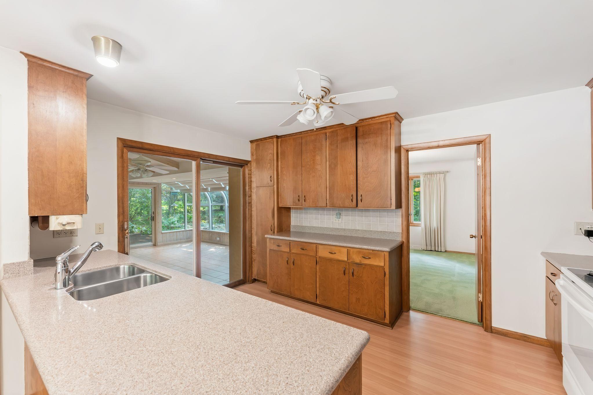 Enter both the formal dining room and the solarium from the kitchen