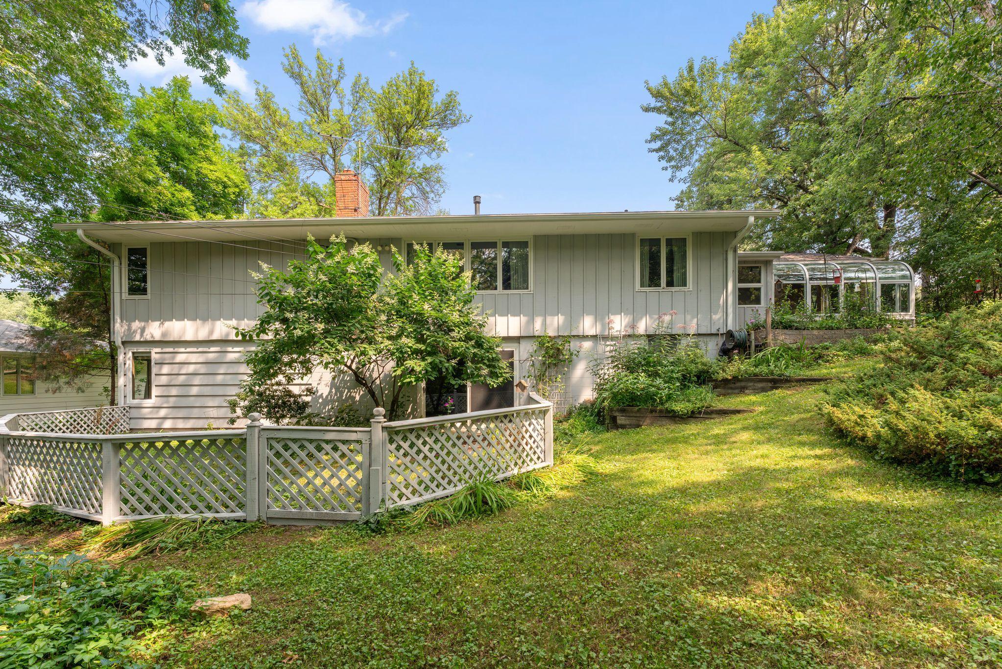 Small fenced in area from the walkout lower level of the home