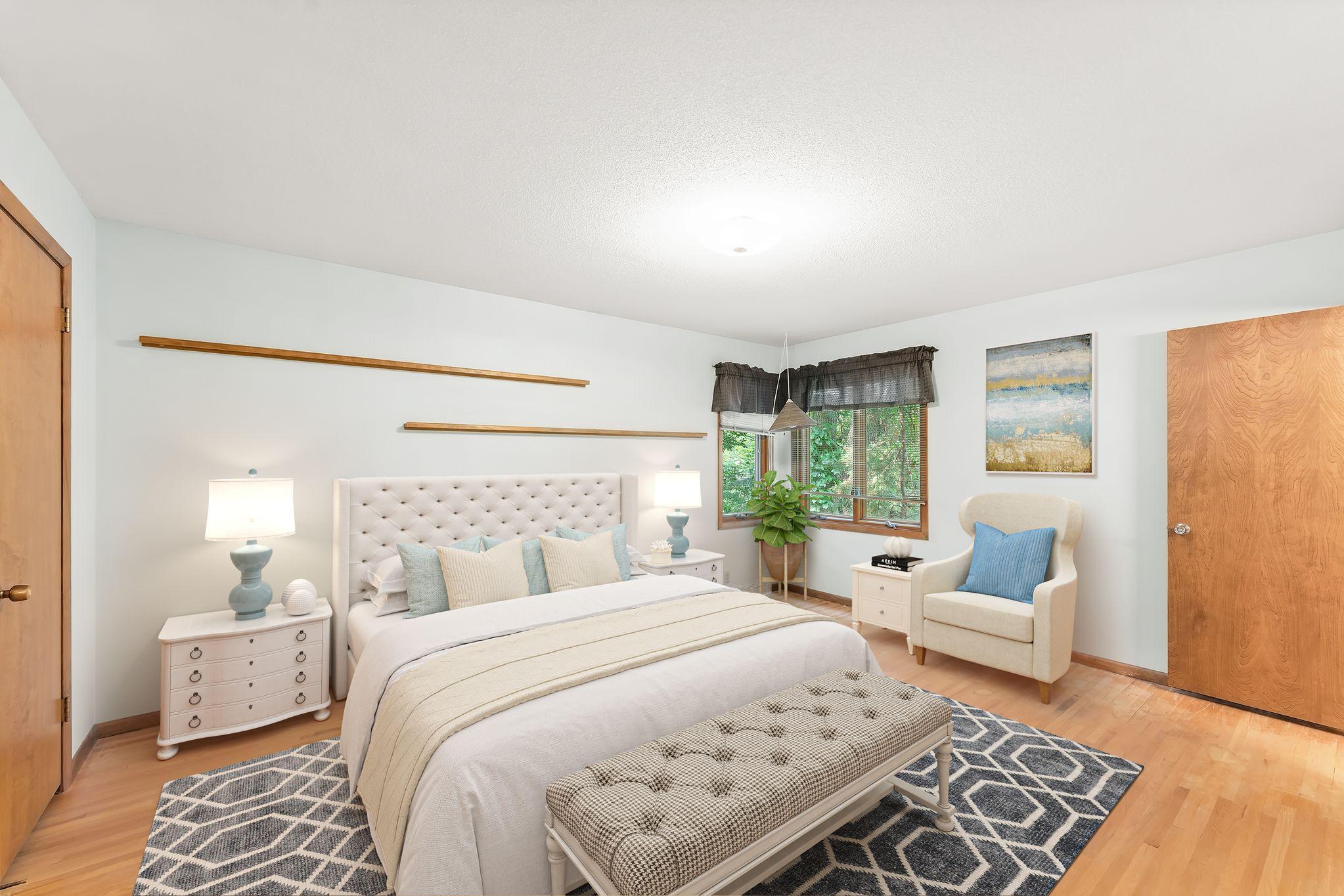 This virtually staged primary bedroom allows space for a king size bed and so much more