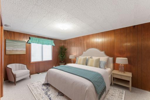 Virtually staged 5th bedroom in the lower level of the home