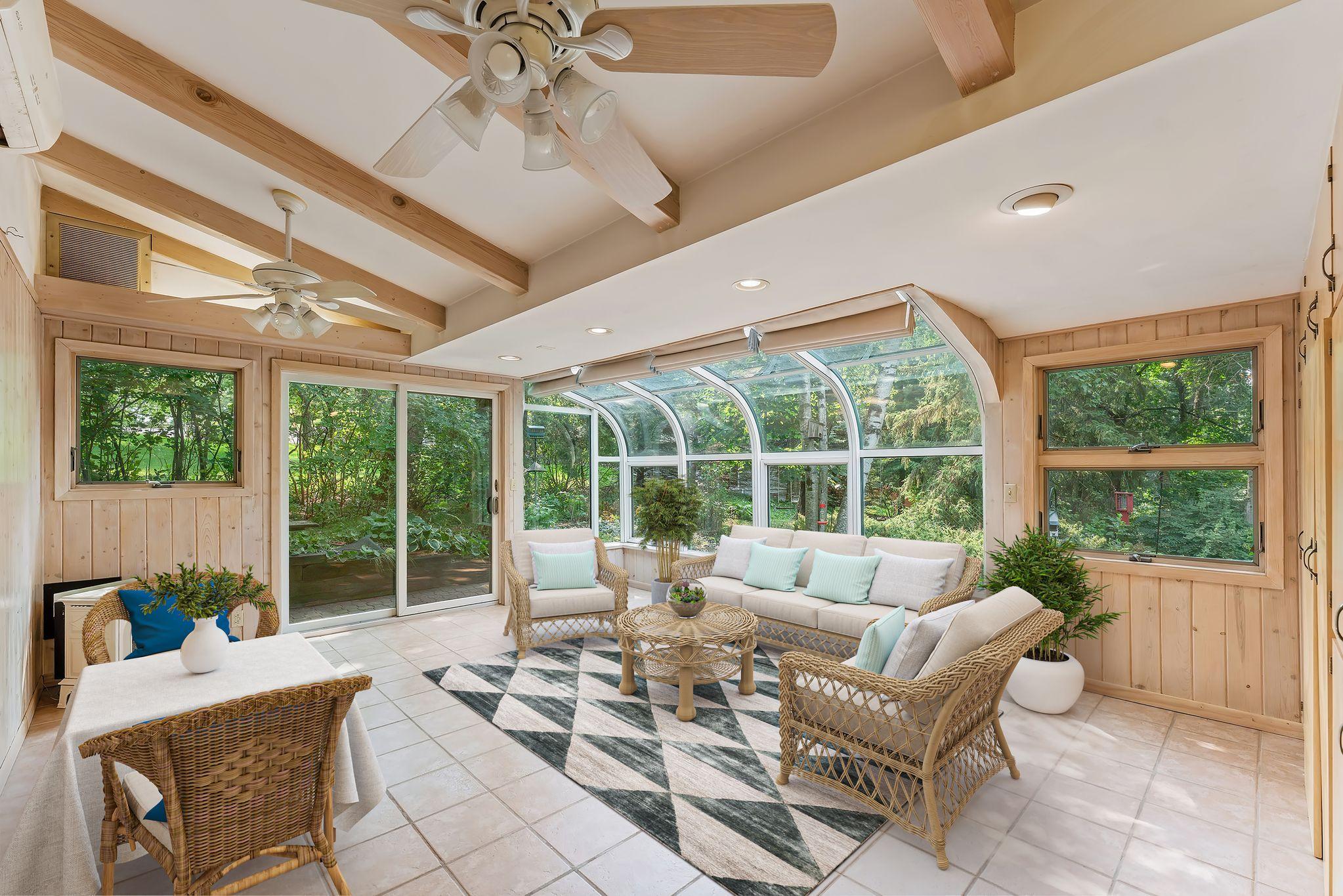 As you see in this virtually staged solarium, there is room for casual dining, entertaining, and relaxation.