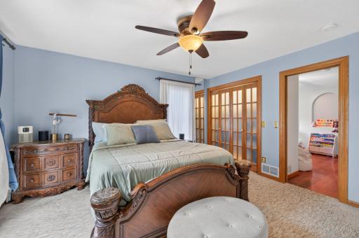 Dual closets one with walk in and ceiling fans