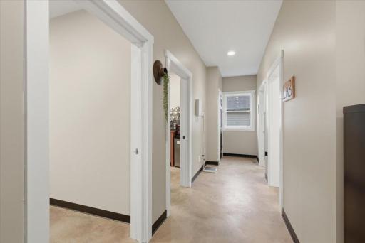 These beautiful, colored concrete floors are easy to clean, are modern and are throughout the entire main level. Each room currently being used for exam rooms has a sink with water, including the kitchen area