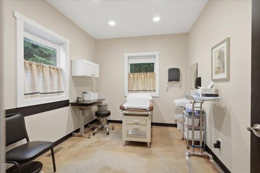 One of the many rooms, currently used as an exam room equipped with a sink