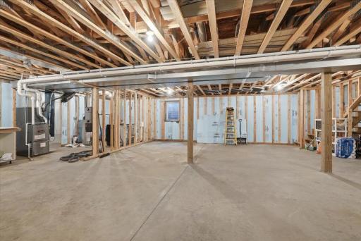 Bright, full basement ready for your creative ideas. This basement has 2 egress windows, roughed in for a bathroom and has laundry facilities. The exposed ceiling offers easy modifications to anything on the main level