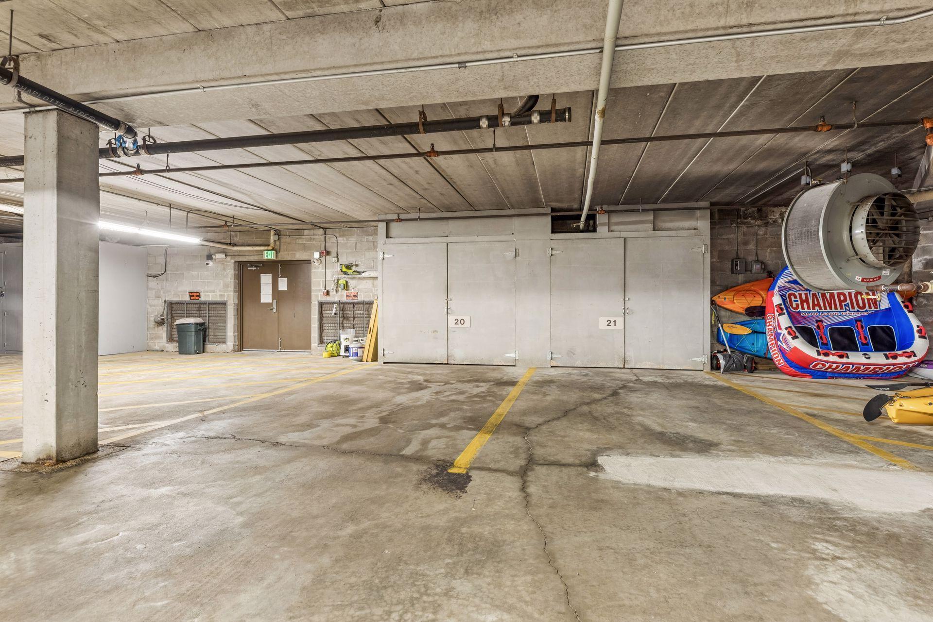 Deeded garage spaces 20 & 21 (with built-in storage) -right next to the double doors out to the lake