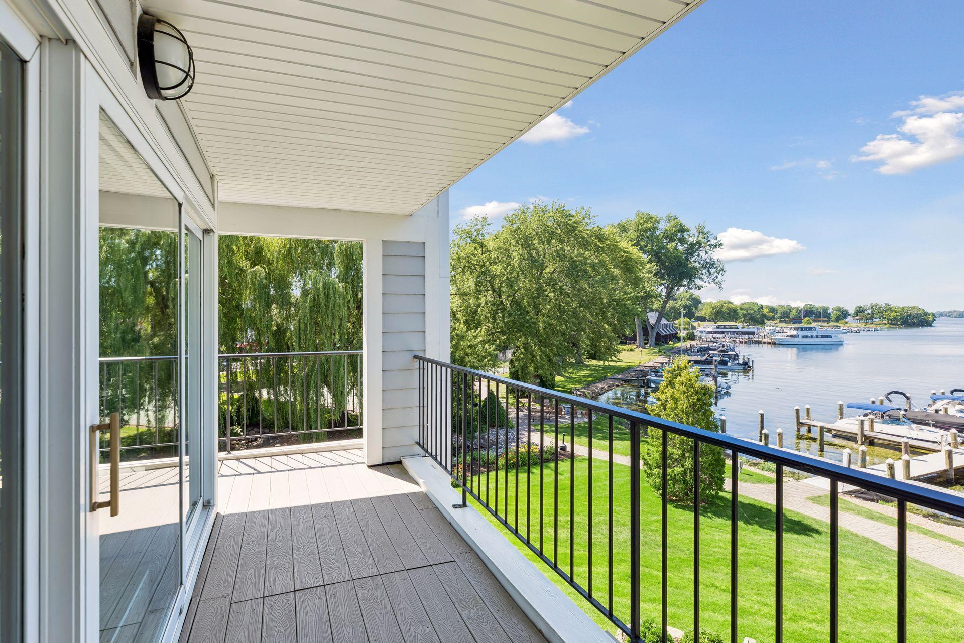 Lovely "L" shaped balcony with views of both the lake and tennis court