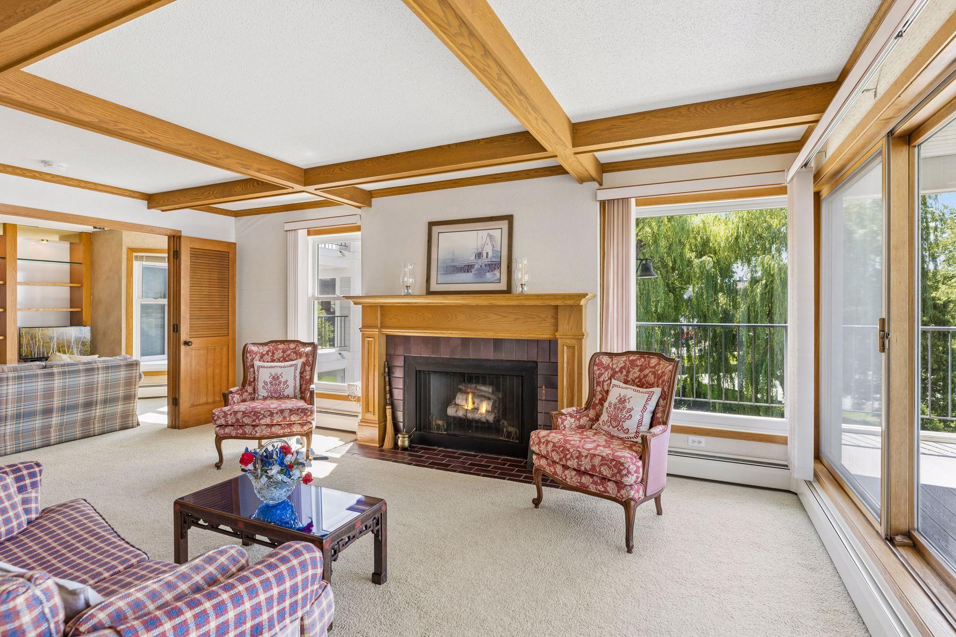 Living room with classic wood burning fireplace