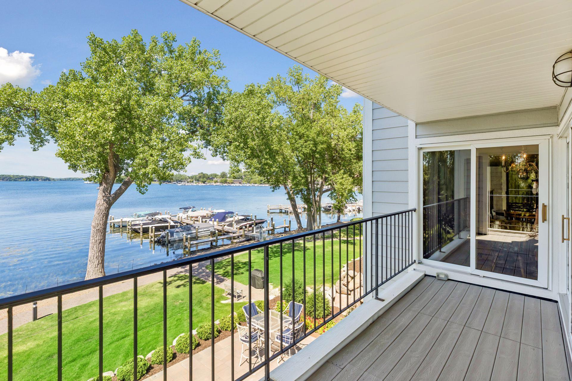 Patio doors open from the dinette and living room onto the balcony with stunning lake views