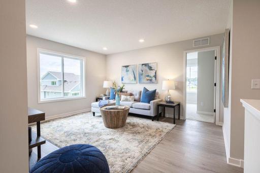 2nd floor features open sun-filled loft, Laundry room, 3 bedrooms including Spacious Primary Ste w/Oversized walk-in Closet. Main floor w/back bedroom+ front office+ Gourmet Kitchen w/abundance of custom cabinets. Photo is from similar home.