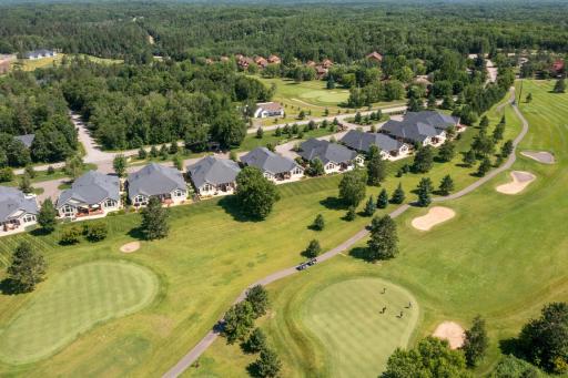 Enjoy peaceful golf course views from this sought-after Breezy Point location.